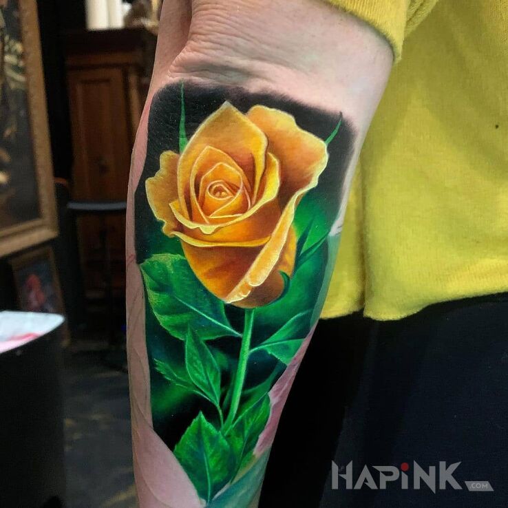 Tattoo Żółta róża in 3D motif and realistic style On the arm
