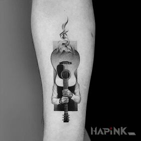 Tattoo Hidden behind the guitar on the forearm motif: black and gray style: graphic / illustrative