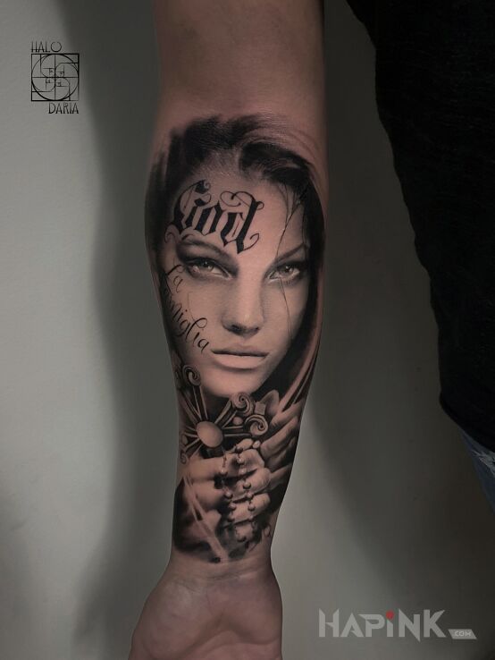 Tattoo Portret kobiety in faces motif and realistic style On the arm