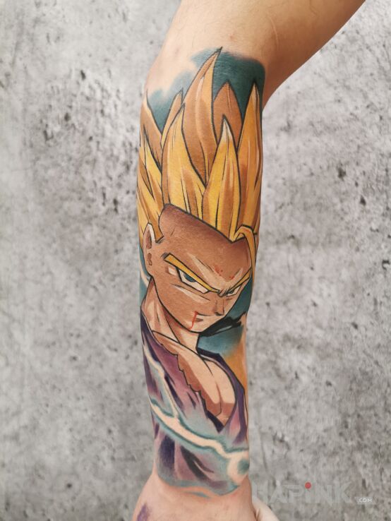 Tattoo Gohan Dragon Ball in faces motif and cartoon / comic book style on the forearm