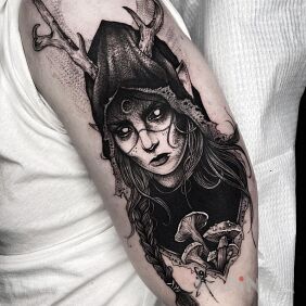 Tattoo Girl with horns on the upper arm motif: faces style: graphic / illustrative