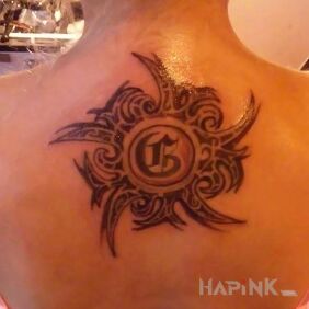 Tattoo Women's mauri on the back motif: lettering style: tribal