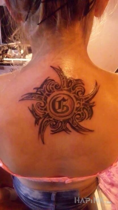 Tattoo Damski mauri in lettering motif and tribal style on the back