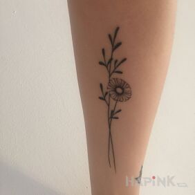 Tattoo Flower on the forearm motif: black and gray style: minimalistic
