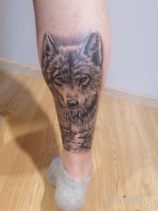 Tattoo Wilk in black and gray motif and realistic style on the leg