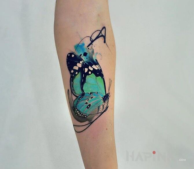 Tattoo Śliczny motyl in butterflies motif and realistic style on the forearm