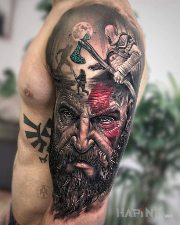 Tattoo God of war in faces motif and realistic style on the upper arm