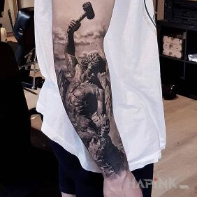 Tattoo Hammer into stone on the forearm motif: characters style: realistic