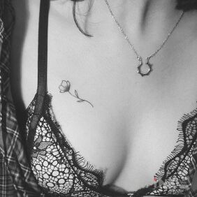 Tattoo Mini mini flower on the breast motif: flowers style: minimalistic