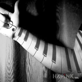 Tattoo Piano on the upper arm motif: sleeves
