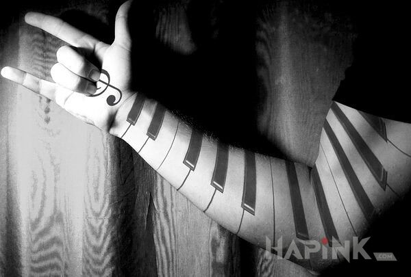 Tattoo Pianino in sleeves motif on the forearm