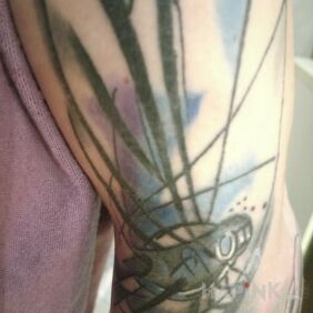 Tattoo Dragonfly on the forearm motif: colorful style: Watercolor