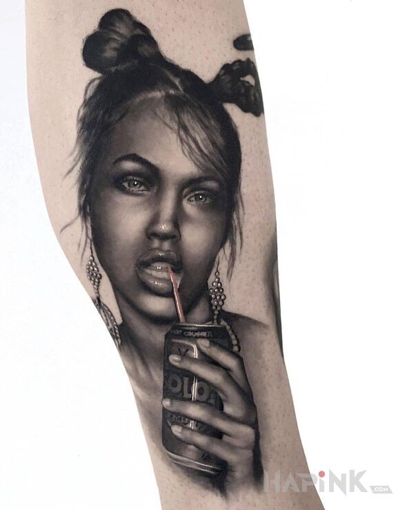 Tattoo Daj łyka in faces motif and realistic style on the forearm
