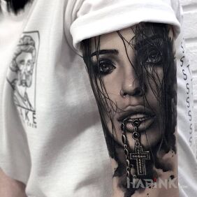 Tattoo Sexy girl On the arm motif: black and gray style: realistic