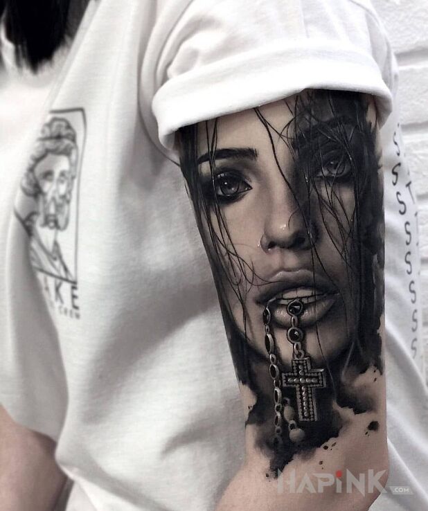 Tattoo Sexy dziewczyna in faces motif and realistic style on the upper arm