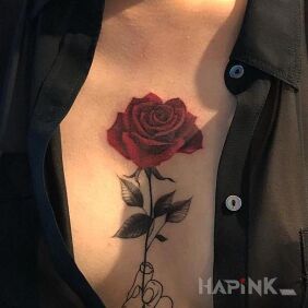 Tattoo Hand with a rose on the breast motif: flowers style: contour / linework
