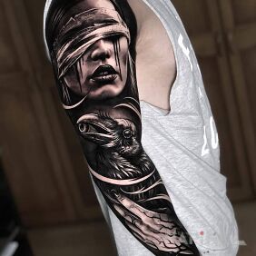 Tattoo Gouged out eyes on the forearm motif: black and gray style: realistic