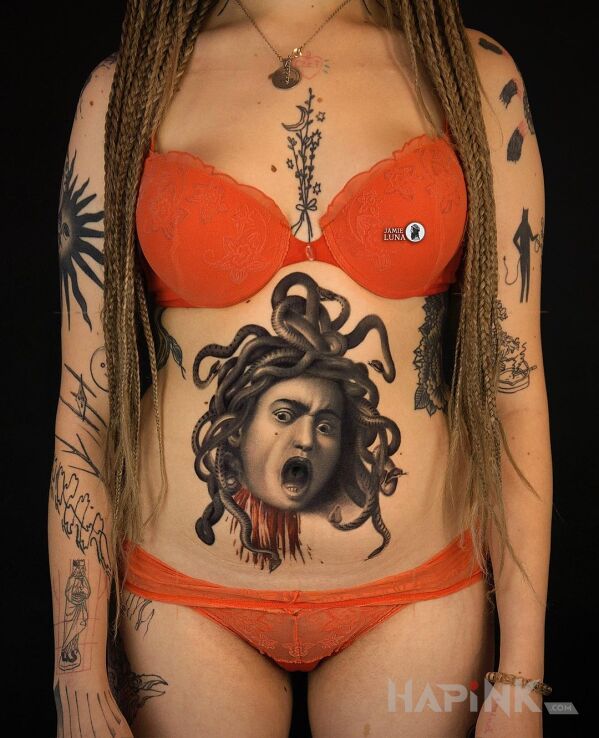 Tattoo Głowa medusy in faces motif and realistic style on the chest
