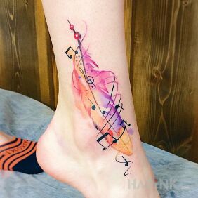 Tattoo Watercolor feather near the ankle motif: colorful style: Watercolor