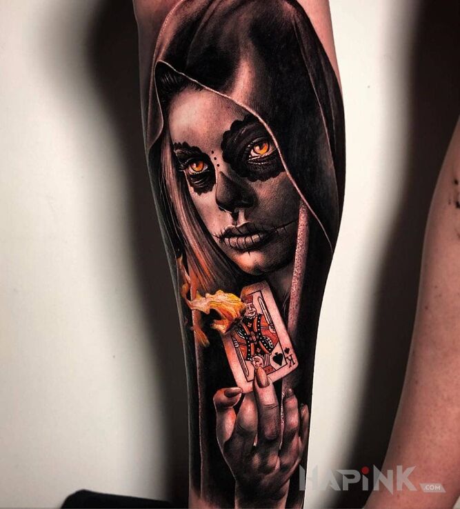 Tattoo Karta w płomieniach in 3D motif and realistic style on the calf