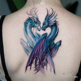 Tattoo Dragon and dragoness on the back motif: fantasy style: graphic / illustrative