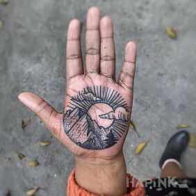 Tattoo Sun behind the mountains on the hand motif: other style: dotwork