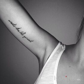 Tattoo Create life around you On the arm motif: lettering