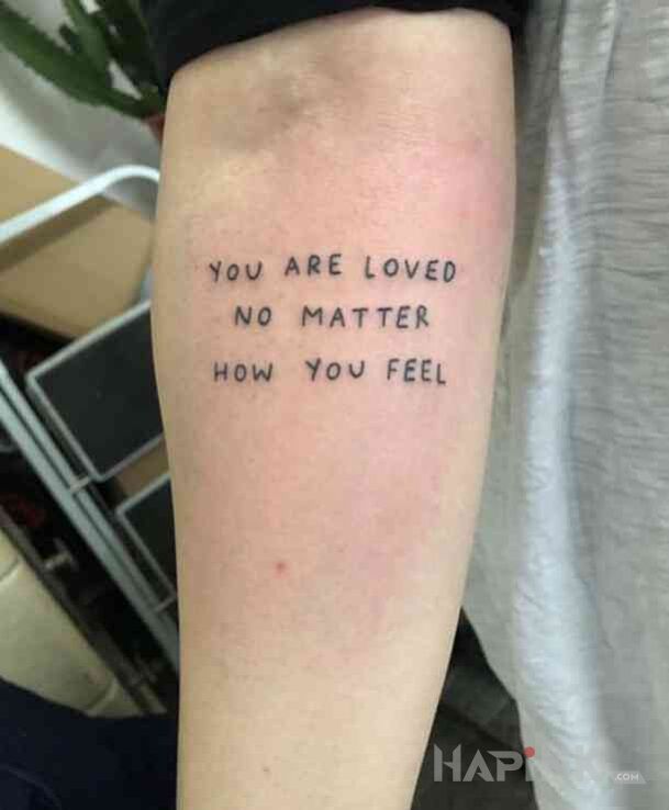 Tattoo Jestes kochany in lettering motif on the forearm