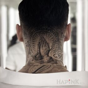 Tattoo Let us pray! on the nape motif: black and gray style: realistic