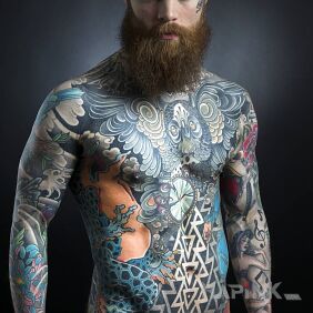 Tattoo Tattooed bearded man on the upper arm motif: colorful style: japanese / irezumi