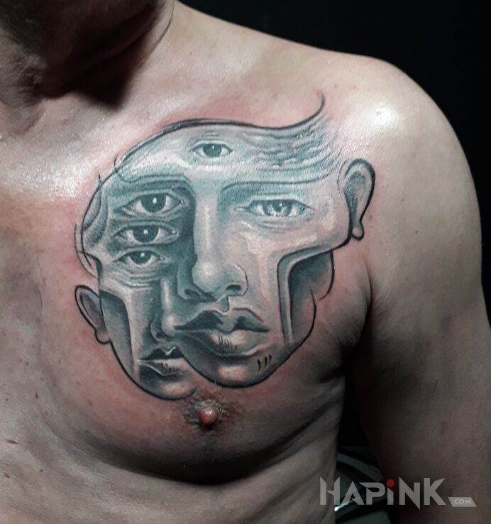 Tattoo Ból  pandemiczny in faces motif and surrealistic style on the chest