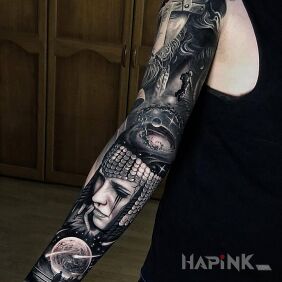 Tattoo Woman in sequins on the upper arm motif: black and gray style: realistic