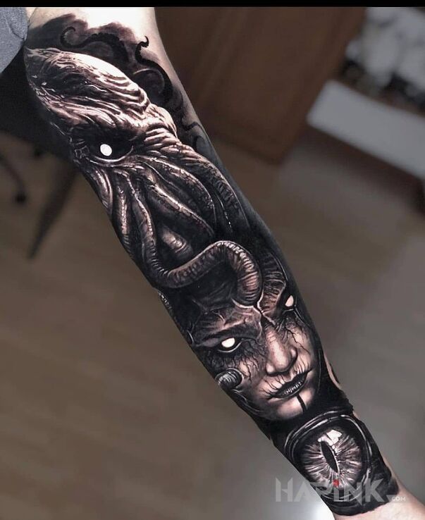 Tattoo Cthulhu in faces motif and realistic style On the arm