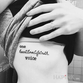 Tattoo One voice on the ribs motif: lettering