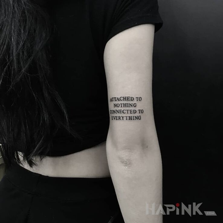 Tattoo Nic i wszystko in lettering motif On the arm