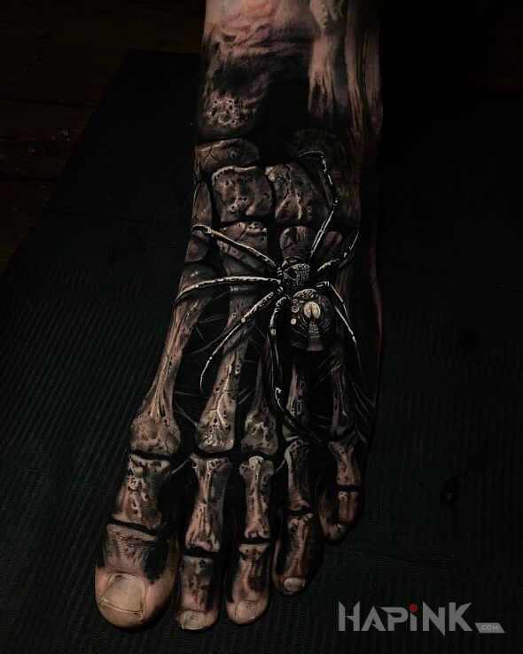 Tattoo Koscista stopa in dark motif and realistic style on the foot