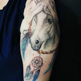 Tattoo Horse dreamcatcher on the upper arm motif: objects style: realistic