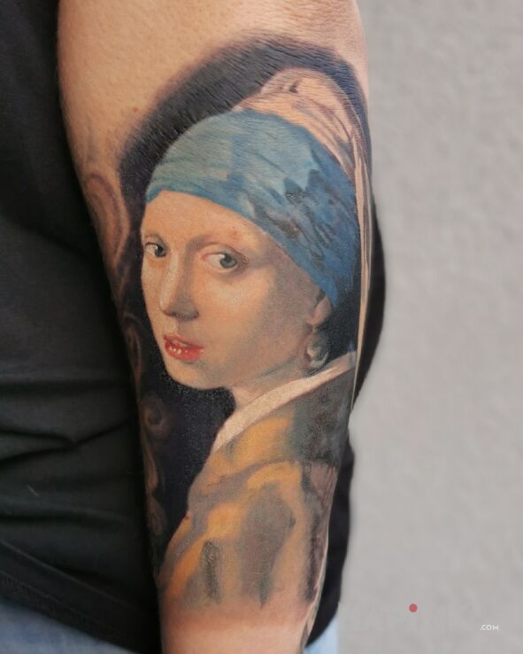 Tattoo Girl with a Pearl Earring in faces motif and realistic style On the arm