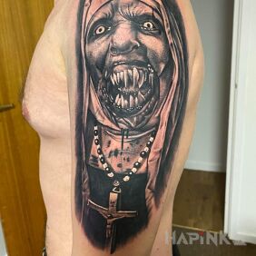 Tattoo Tattoo on the shoulder possessed nun on the upper arm motif: faces style: realistic