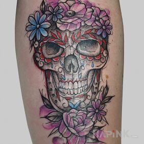 Tattoo Colorful skull on the forearm motif: skulls style: graphic / illustrative