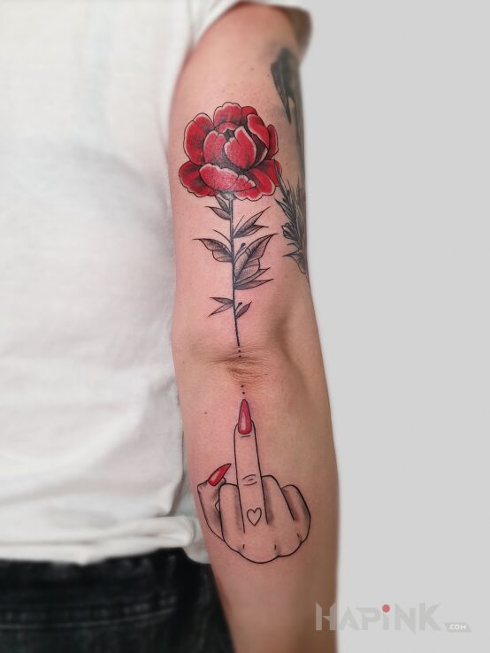 Tattoo Babski przekaz in flowers motif and graphic / illustrative style On the arm