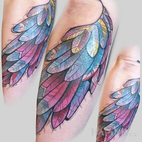 Tattoo Wing on the forearm motif: wings style: graphic / illustrative