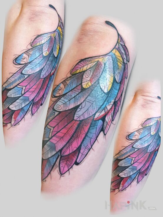 Tattoo Skrzydlo in colorful motif and graphic / illustrative style on the forearm