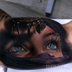 Tattoo Realistic face on the upper arm motif: 3D style: realistic