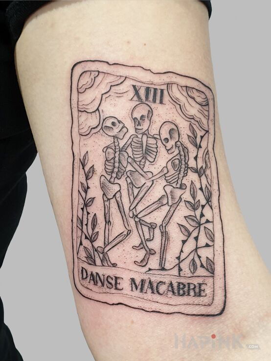 Tattoo Tarot in religious motif and engravings / gravure style On the arm