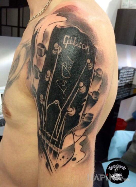 Tattoo Gibson Les paul od Alexa! !!! in realistic style on the upper arm