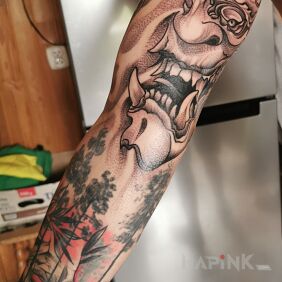 Tattoo Demon on the upper arm motif: black and gray style: graphic / illustrative
