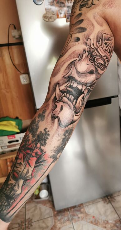 Tattoo Demon in demons motif and graphic / illustrative style On the arm