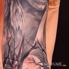 Tattoo Little Indian girl on the forearm motif: black and gray style: realistic