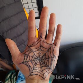 Tattoo Spiderweb on the hand motif: black and gray style: graphic / illustrative